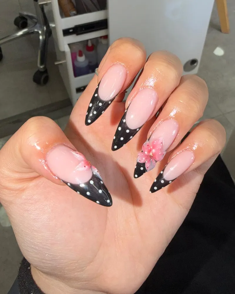 Black polka dot French tips with a 3D flower